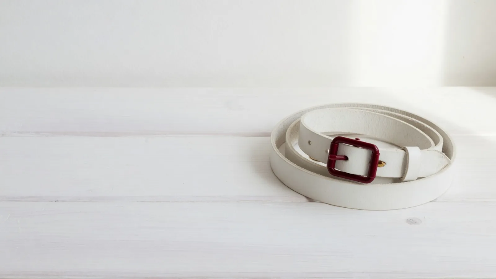 A belt on white linen
